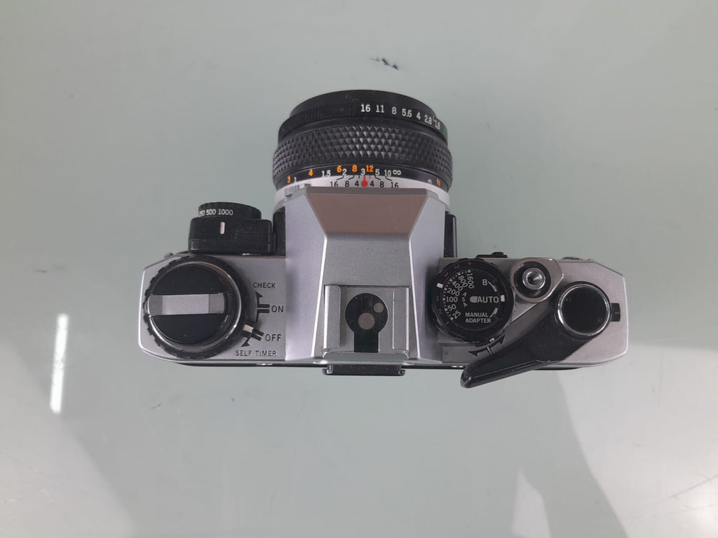 OLYMPUS OM 10 SLR CAMERA WITH ZUIKO MC AUTO-S 1:1.8 F=50MM LENS