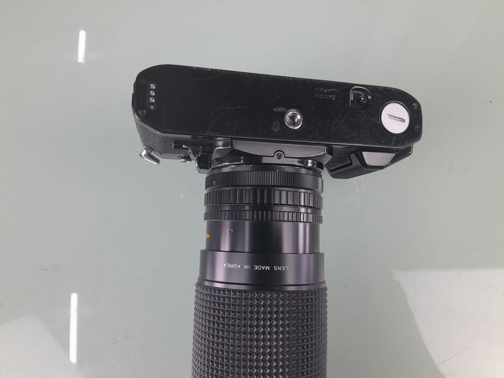 CANON A 1 SLR CAMERA WITH SIRIUS F=28-200MM 1:4.0-5.6 LENS