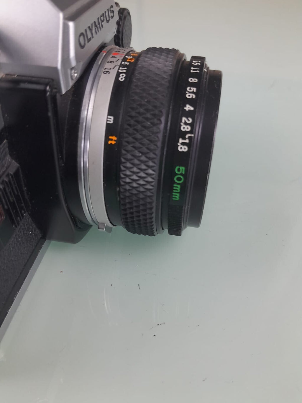 OLYMPUS OM 10 SLR CAMERA WITH ZUIKO MC AUTO-S 1:1.8 F=50MM LENS