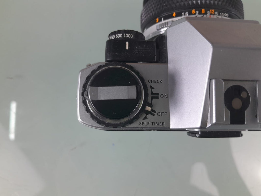 OLYMPUS OM 10 SLR CAMERA WITH ZUIKO MC AUTO-S 1:1.8 F=50MM LENS