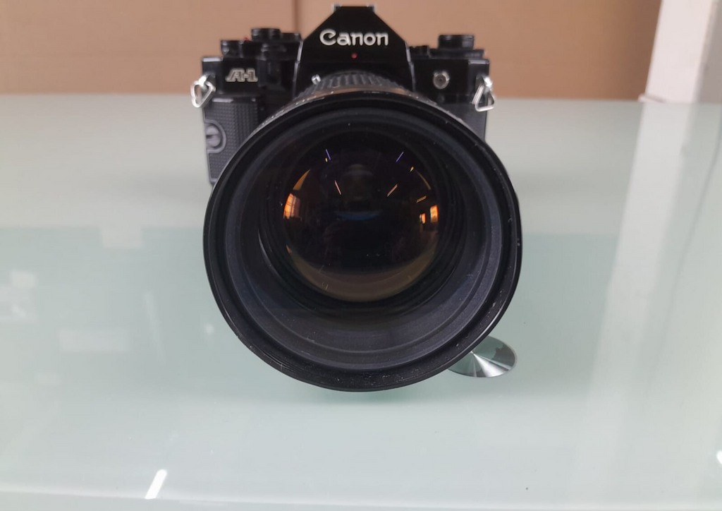 CANON A 1 SLR CAMERA WITH SIRIUS F=28-200MM 1:4.0-5.6 LENS